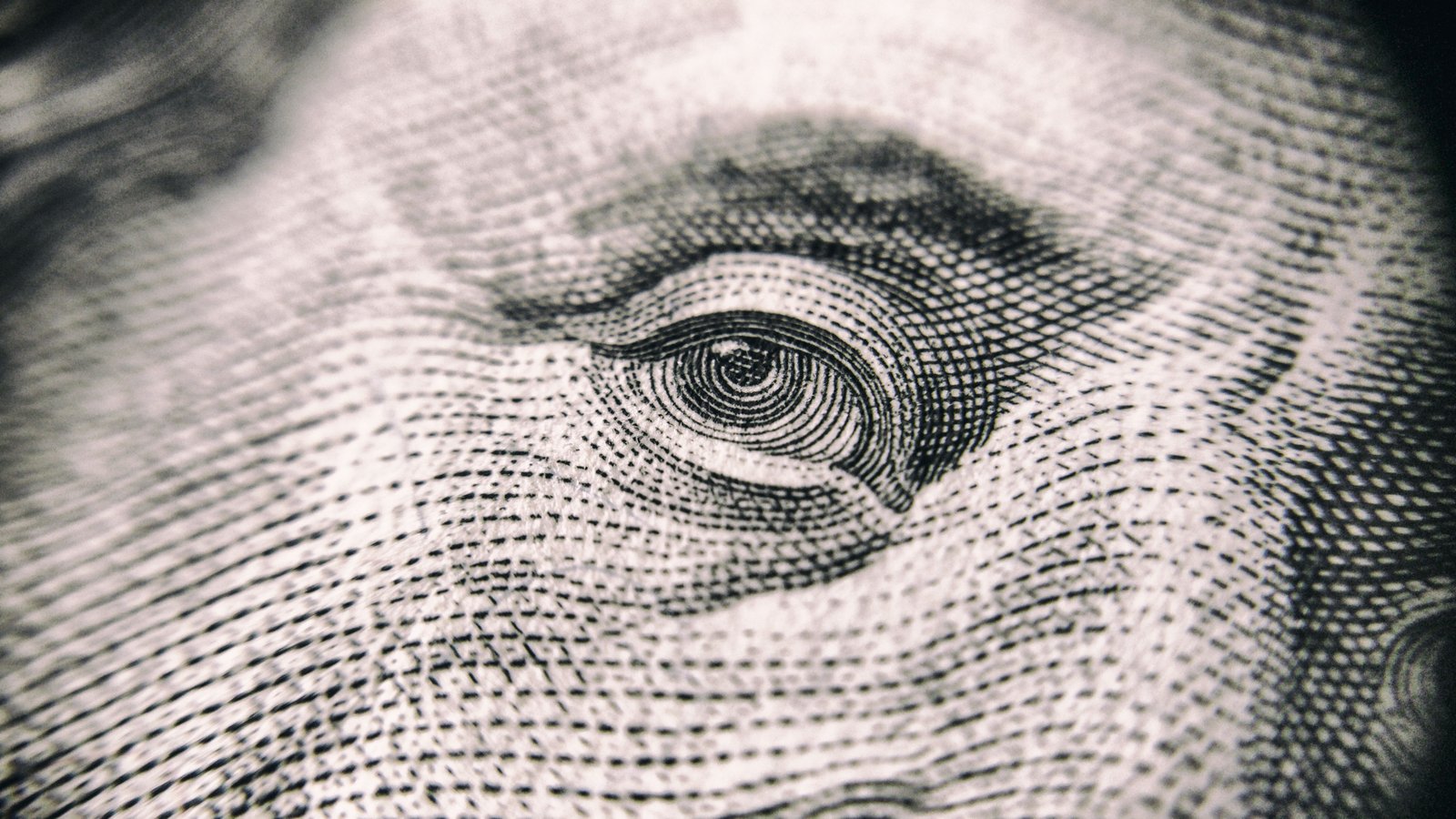 Macro detail of an engraved portrait on a banknote